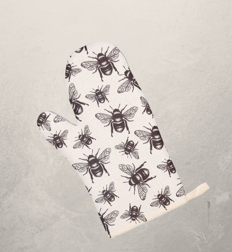 white oven mitt with black honey bee pattern