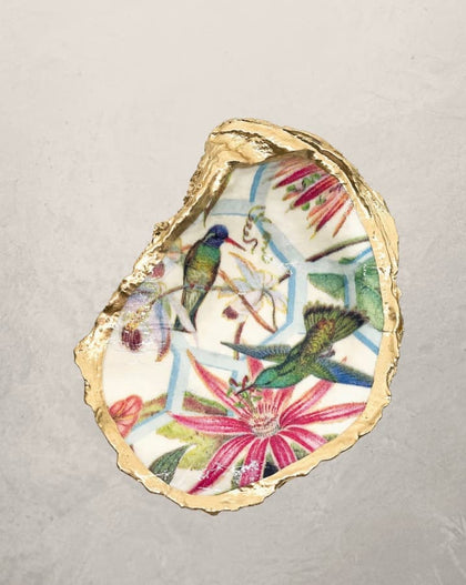 oyster shell trinket dish with hummingbird and floral design and gold edge