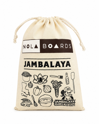 A beige canvas drawstring pouch featuring black printed graphics and text, including 'NOLA BOARDS', 'JAMBALAYA', and food-themed illustrations, on a white background.