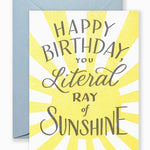 Greeting card with hand-lettered “You Are a Ray of Sunshine” text in cheerful style, shown with kraft envelope