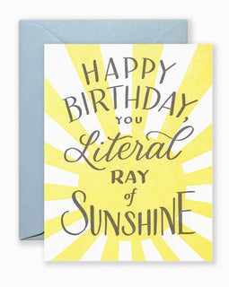 Greeting card with hand-lettered “You Are a Ray of Sunshine” text in cheerful style, shown with kraft envelope