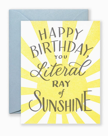Greeting card with hand-lettered “You Are a Ray of Sunshine” text in cheerful style, shown with kraft envelope