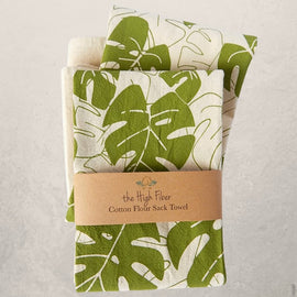 monstera leaf tea towel with green botanical print on natural cotton, modern kitchen towel made from recycled Turkish cotton
