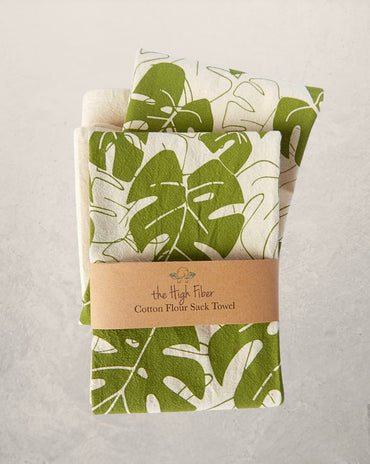 monstera leaf tea towel with green botanical print on natural cotton, modern kitchen towel made from recycled Turkish cotton
