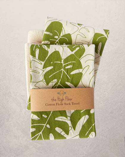 monstera leaf tea towel with green botanical print on natural cotton, modern kitchen towel made from recycled Turkish cotton