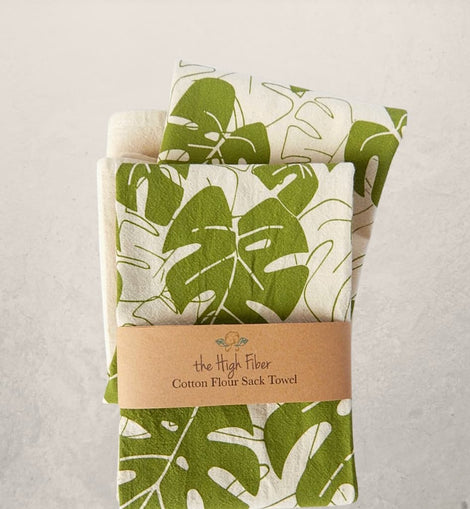 monstera leaf tea towel with green botanical print on natural cotton, modern kitchen towel made from recycled Turkish cotton