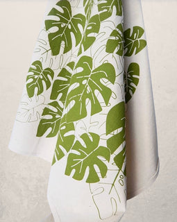 monstera leaf tea towel with green botanical print on natural cotton, modern kitchen towel made from recycled Turkish cotton