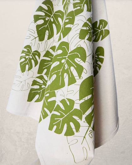 monstera leaf tea towel with green botanical print on natural cotton, modern kitchen towel made from recycled Turkish cotton