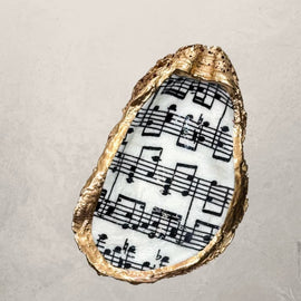 oyster shell trinket dish with sheet music design and gold edge