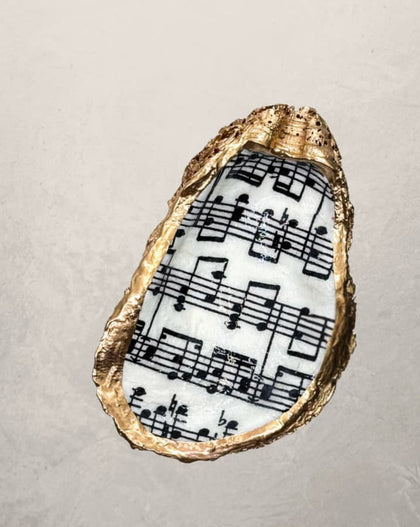 oyster shell trinket dish with sheet music design and gold edge