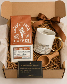 Gift set with Lower Coast Coffee, mug, wooden scoop, and New Orleans-themed items in a box.