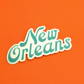 retro style New Orleans script vinyl sticker on orange background