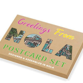 Box of 'Greetings From NOLA Postcard Set' with colorful text and images on a white background