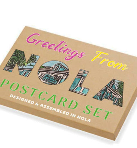 Box of 'Greetings From NOLA Postcard Set' with colorful text and images on a white background