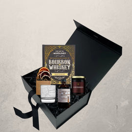 Old Fashioned groomsman gift box with bourbon cocktail kit, mixology book, cherries, citrus garnish, and New Orleans whiskey glass