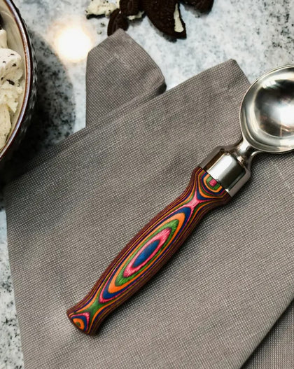 Stainless steel ice cream scoop with rainbow swirl handle