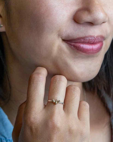 Sterling silver ring featuring a small detailed bronze honeybee on a polished silver band.