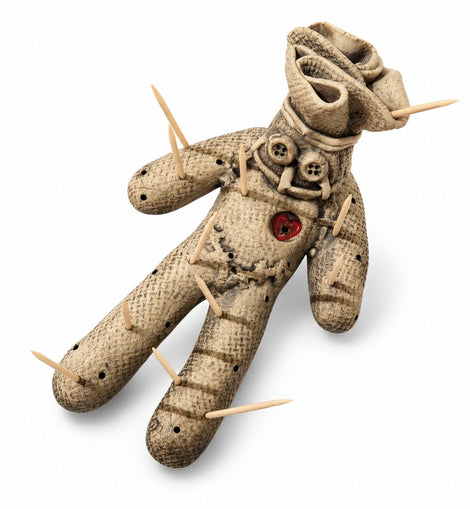 Weathered voodoo doll toothpick holder with button details, red heart accent, and wooden toothpicks.