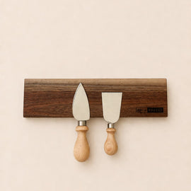 walnut magnetic knife holder with knives mounted on wall