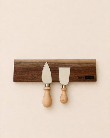 walnut magnetic knife holder with knives mounted on wall