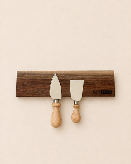 walnut magnetic knife holder with knives mounted on wall