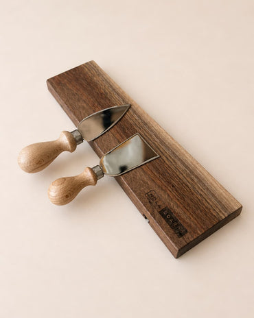 walnut magnetic knife holder with knives mounted on wall