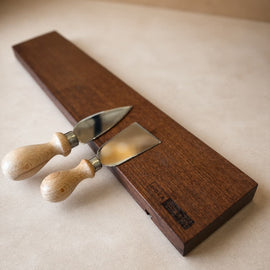 18-inch natural edge walnut magnetic knife holder with knives on a clean neutral background