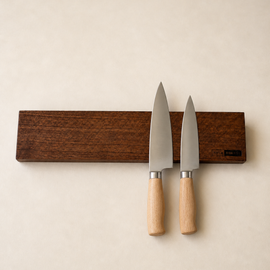 18-inch natural edge walnut magnetic knife holder with knives on a clean neutral background