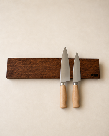 18-inch natural edge walnut magnetic knife holder with knives on a clean neutral background