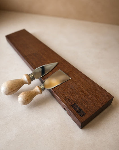 18-inch natural edge walnut magnetic knife holder with knives on a clean neutral background