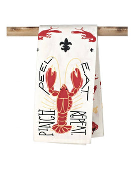 Louisiana crawfish kitchen towel reading “Pinch Peel Eat Repeat” with red crawfish and fleur-de-lis design hanging folded on wooden rod.